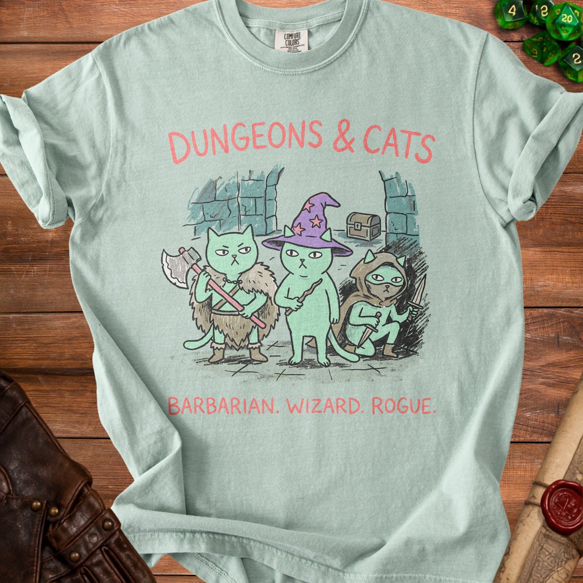 Light blue t-shirt with cartoon cats dressed as D&D characters: Barbarian, Wizard, Rogue.