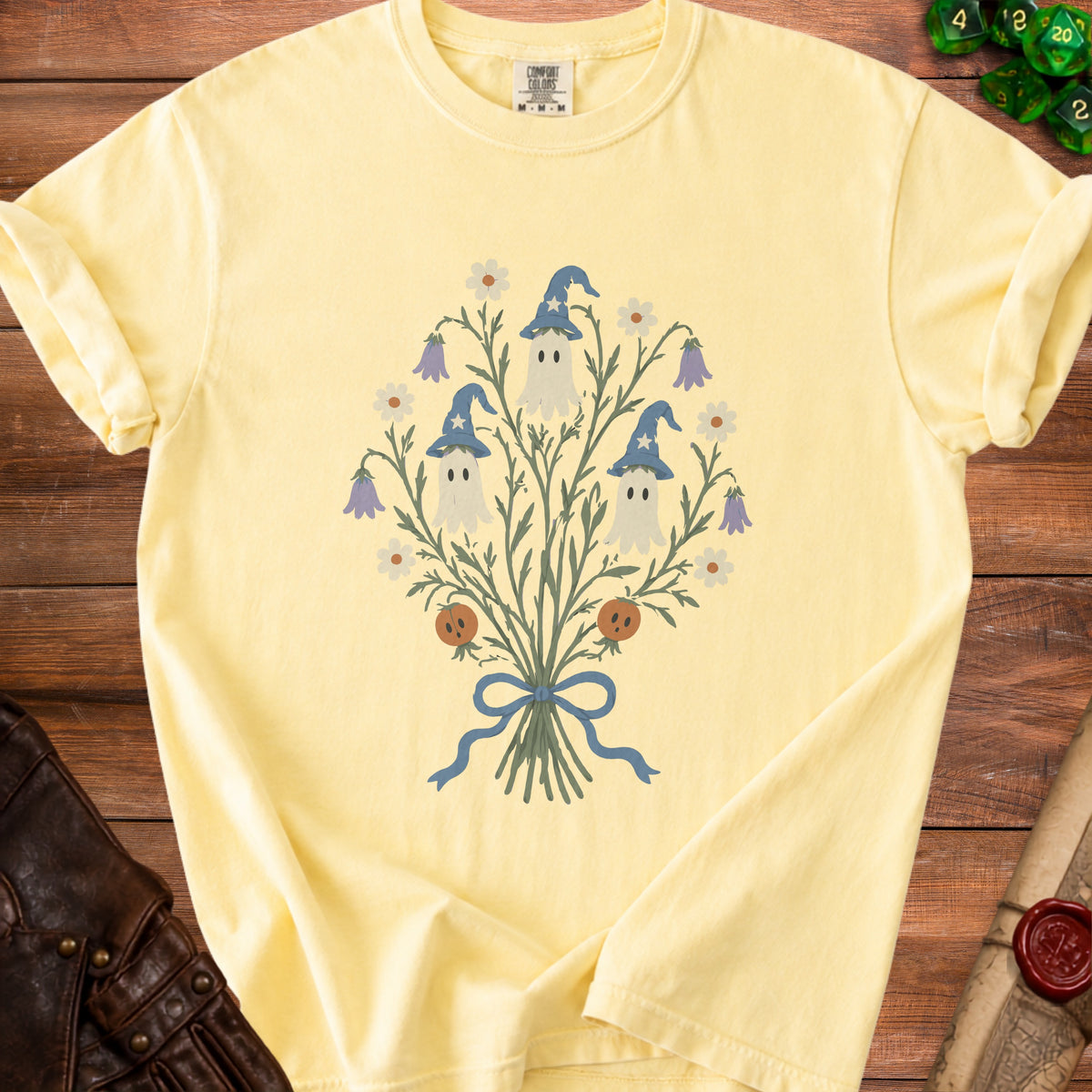 Yellow t-shirt with a bouquet of ghosts, pumpkins, and flowers design.