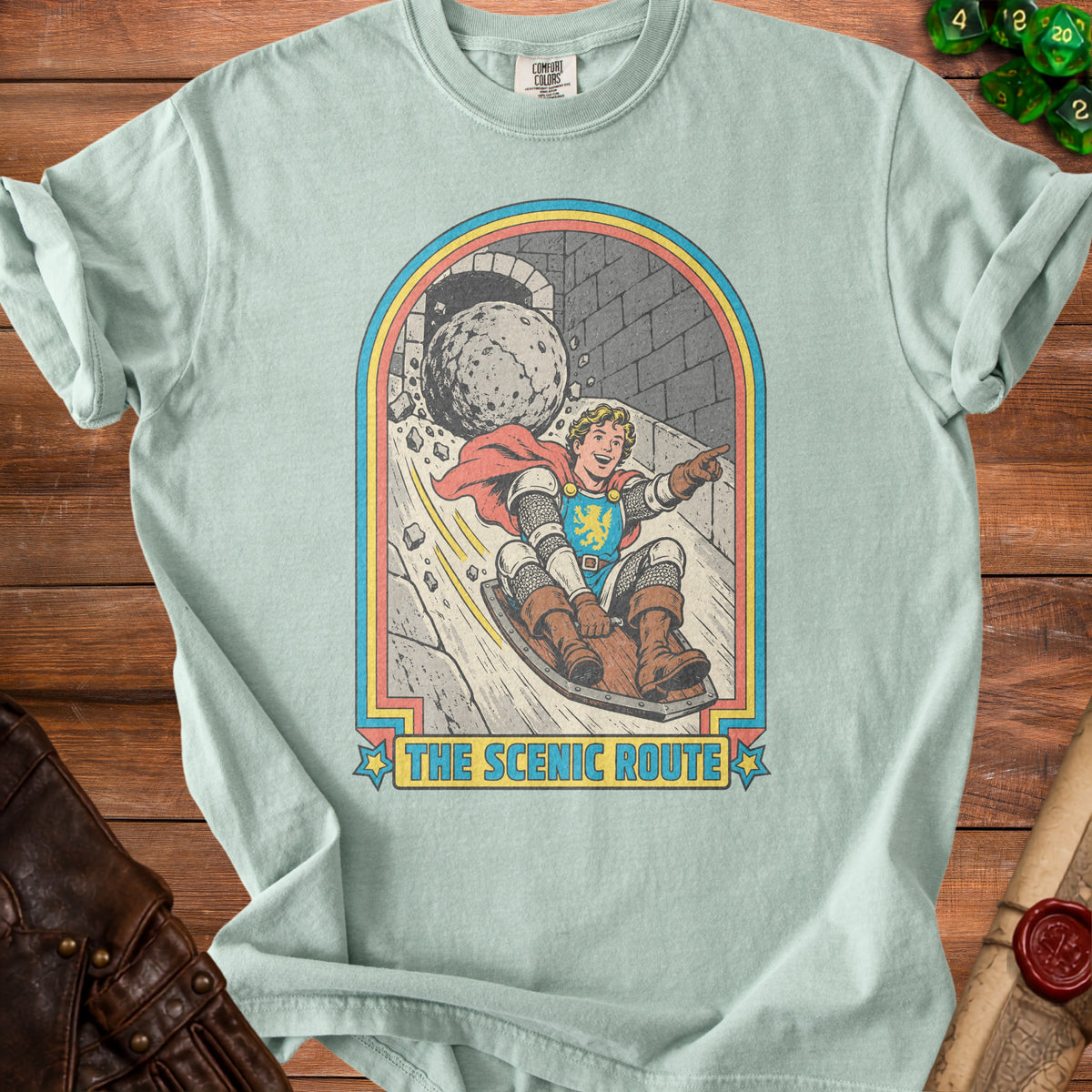 Shirt graphic: Knight on a sled chased by a boulder, text "The Scenic Route".