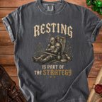 T-shirt with a sleeping knight graphic and text "Resting is part of the strategy."