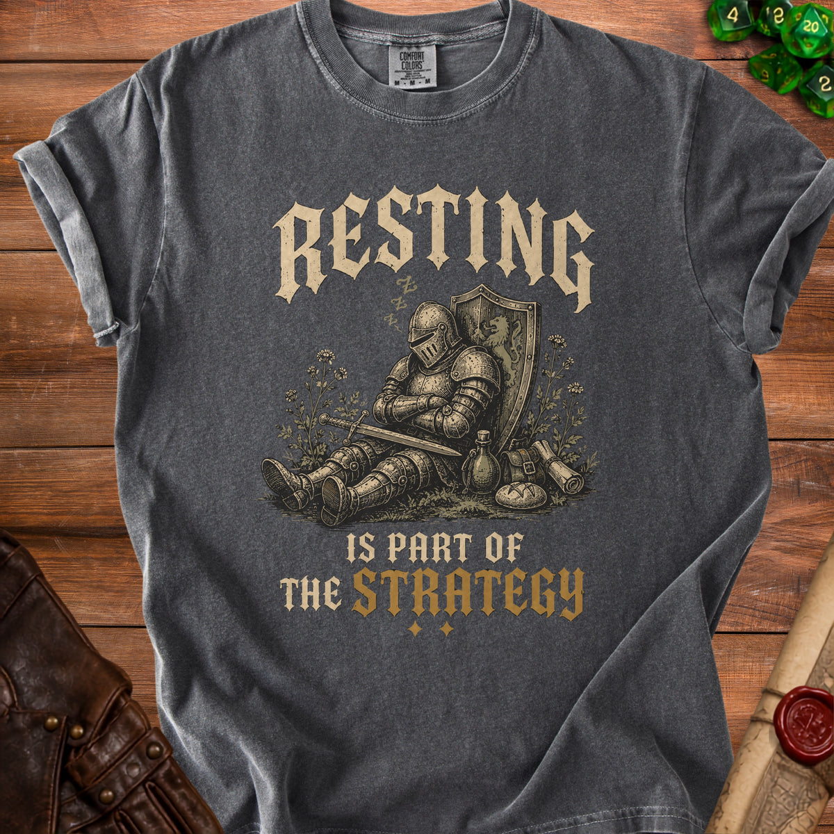 T-shirt with a sleeping knight graphic and text "Resting is part of the strategy."