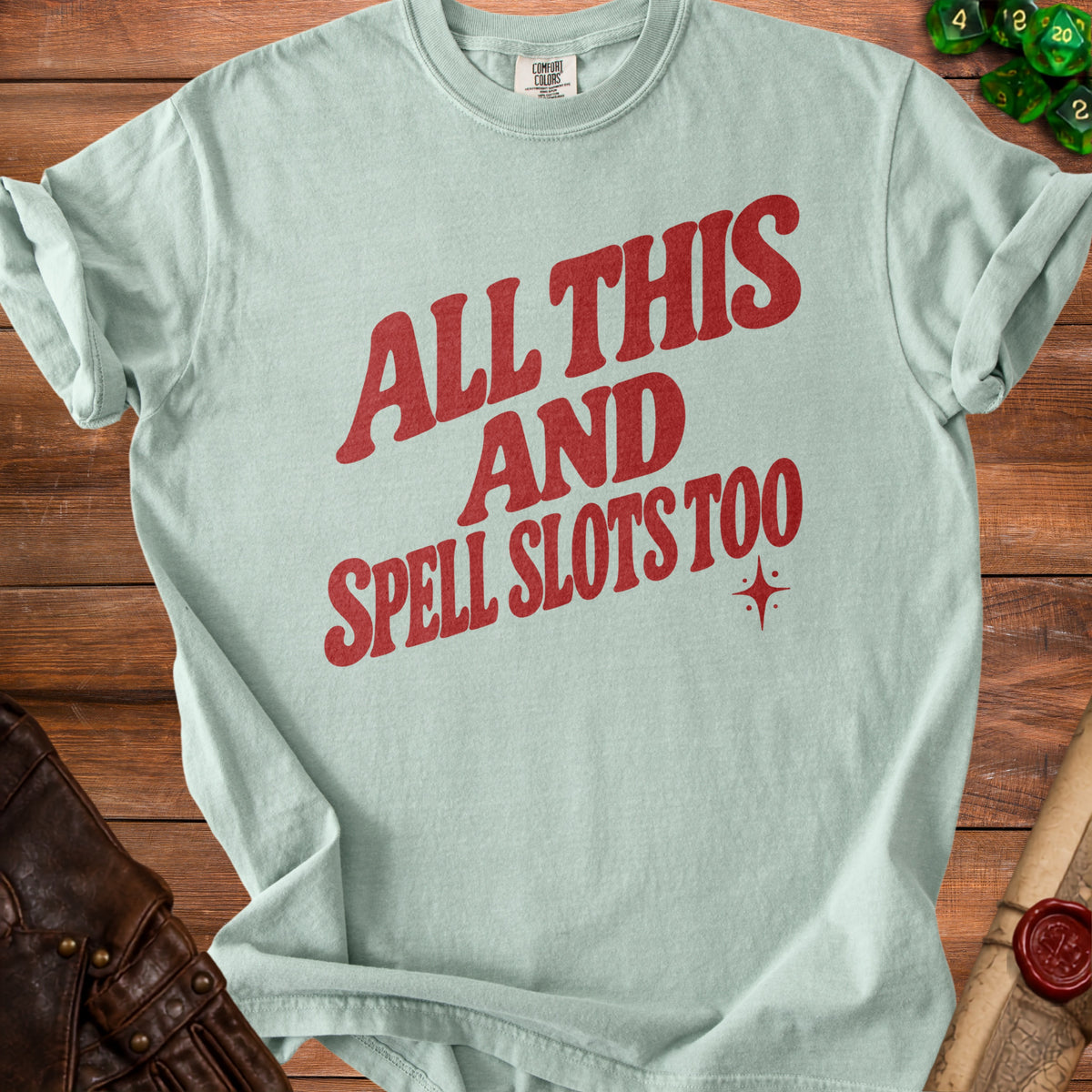 Light blue t-shirt with red text "ALL THIS AND SPELL SLOTS TOO".