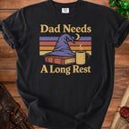 Black t-shirt with "Dad Needs A Long Rest" text, wizard hat, book, and mug graphic.