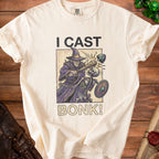 Cream t-shirt with wizard, skeleton, and text "I CAST BONK!".