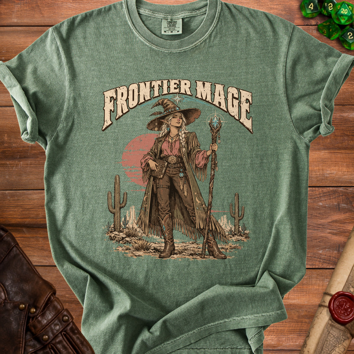 Frontier Mage graphic on green t-shirt with desert scene and wizard character.
