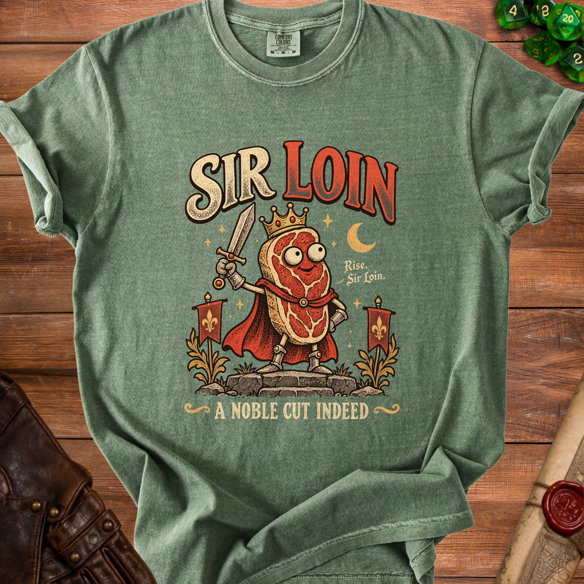 Green t-shirt with "SIR LOIN A NOBLE CUT INDEED" text and cartoon steak knight.
