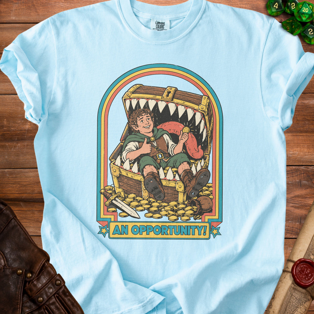 Light blue t-shirt with graphic of hobbit inside treasure chest with text "AN OPPORTUNITY!".