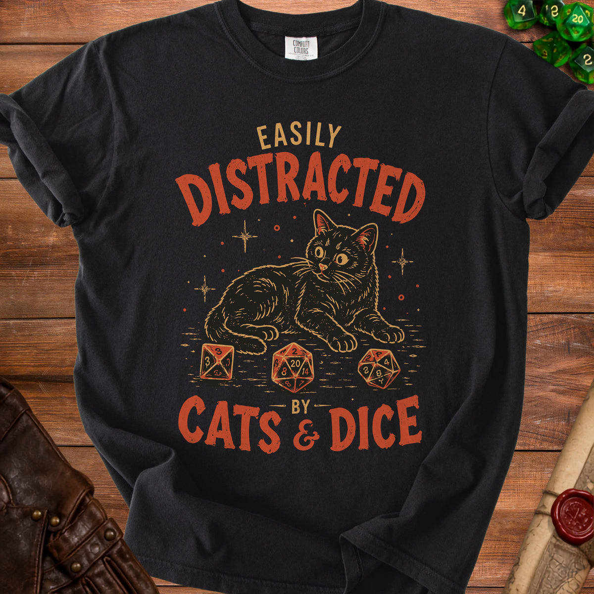 Black t-shirt with "Easily Distracted By Cats & Dice" text and a cat illustration.