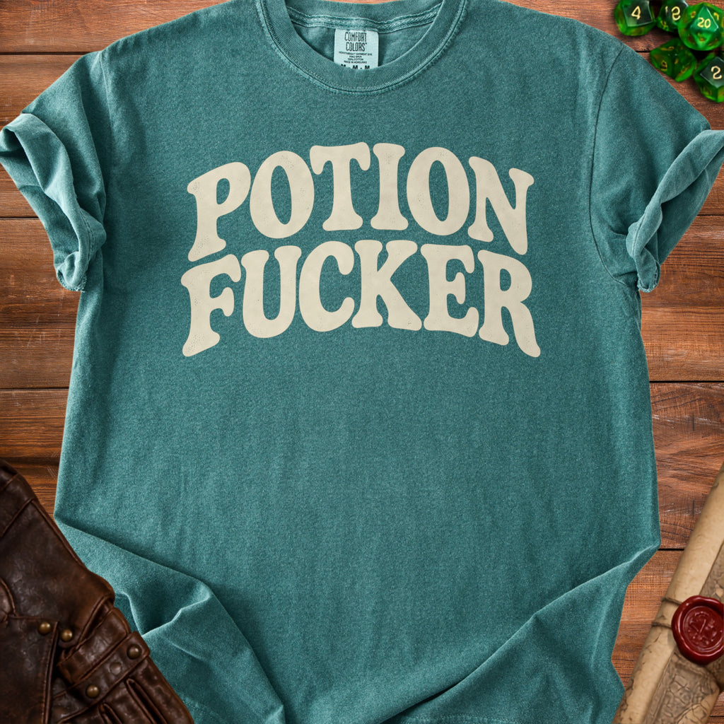 Teal t-shirt with "POTION FUCKER" in distressed cream font.