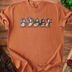 Orange t-shirt featuring a line of cartoon geese dressed as fantasy characters.