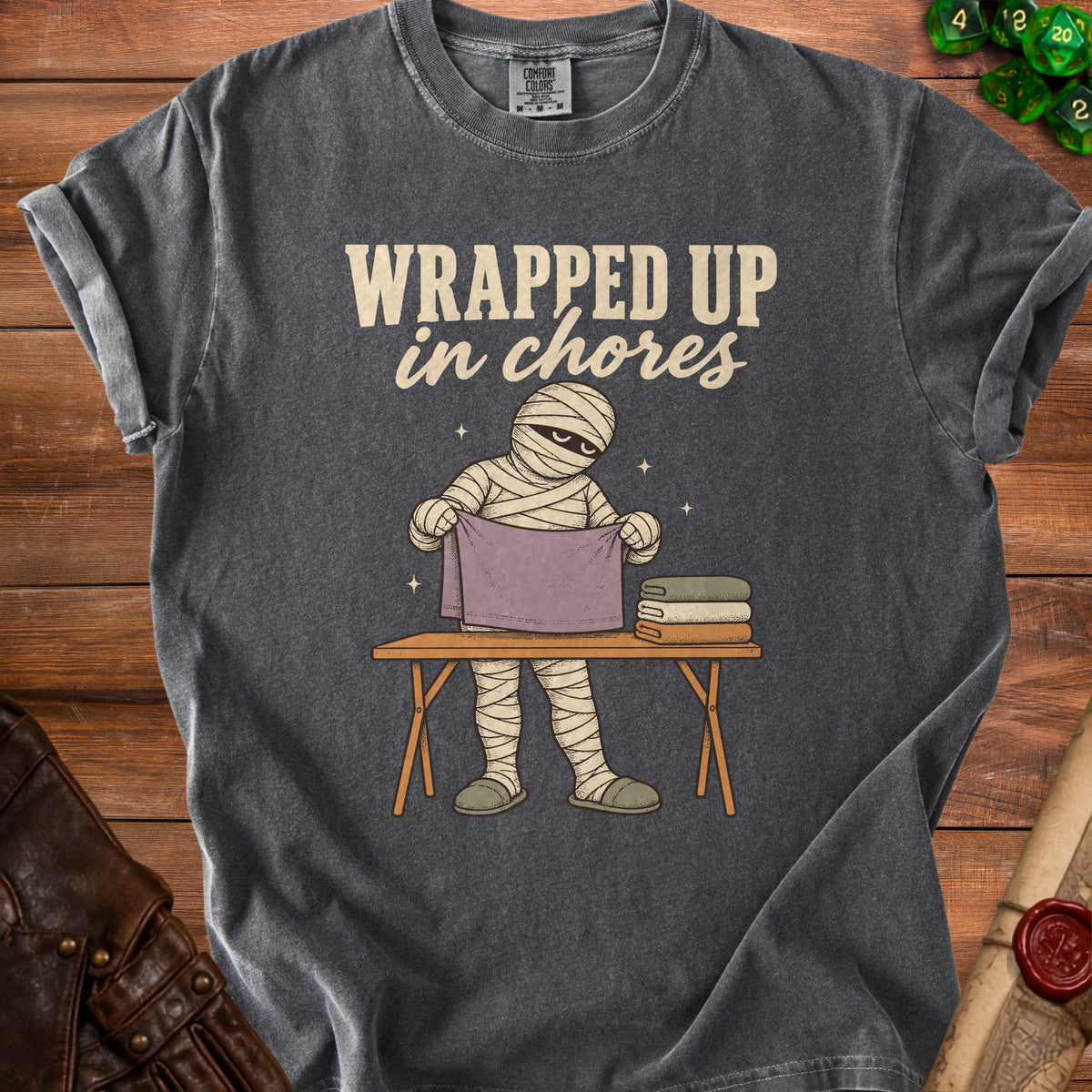 Mummy folding laundry with text "WRAPPED UP in chores."