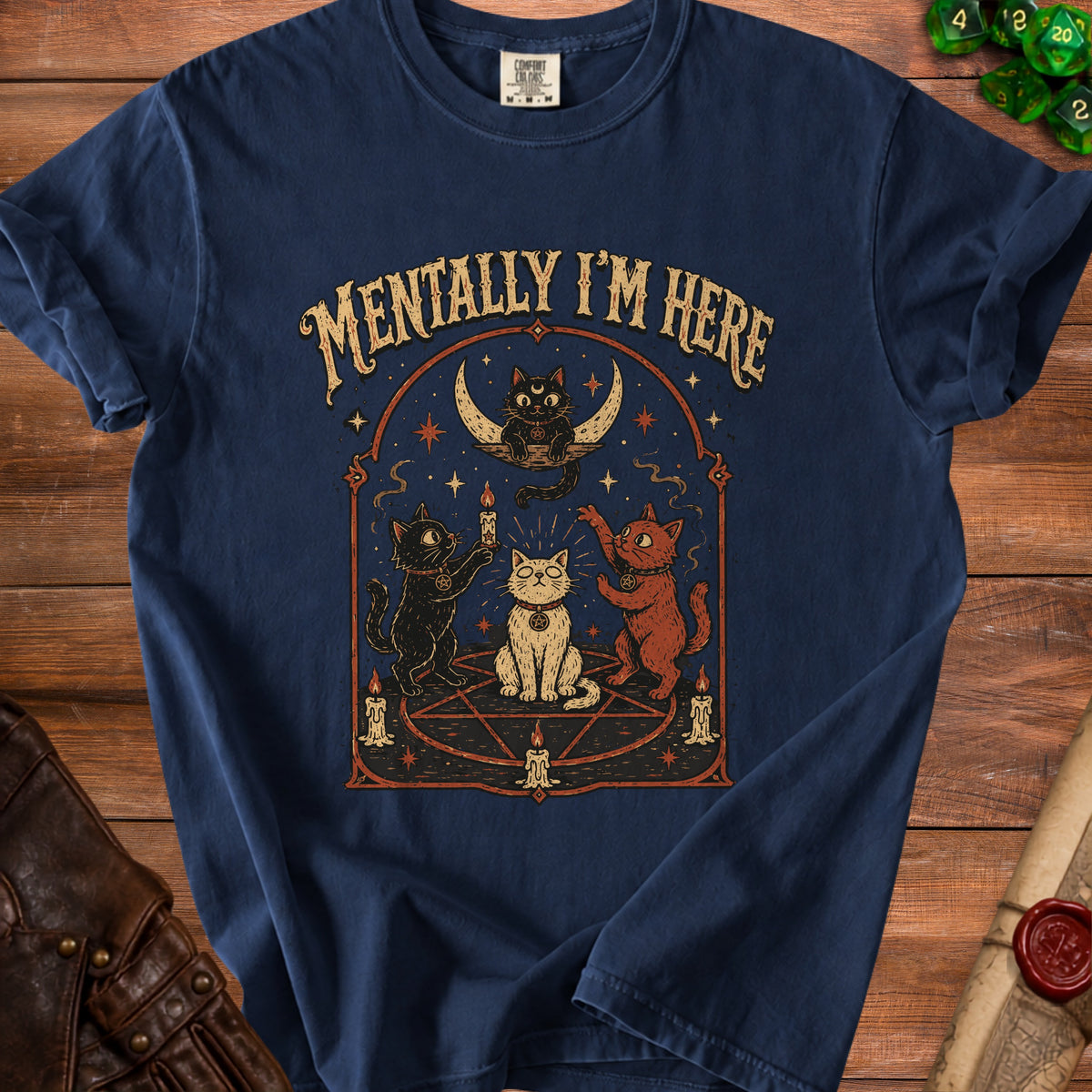 Dark blue t-shirt with "Mentally I'm Here" text and occult cat graphic.