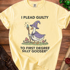 Yellow t-shirt with a goose wizard graphic and text "I PLEAD GUILTY TO FIRST DEGREE SILLY GOOSERY".