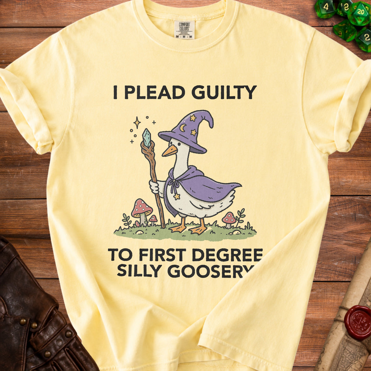 Yellow t-shirt with a goose wizard graphic and text "I PLEAD GUILTY TO FIRST DEGREE SILLY GOOSERY".