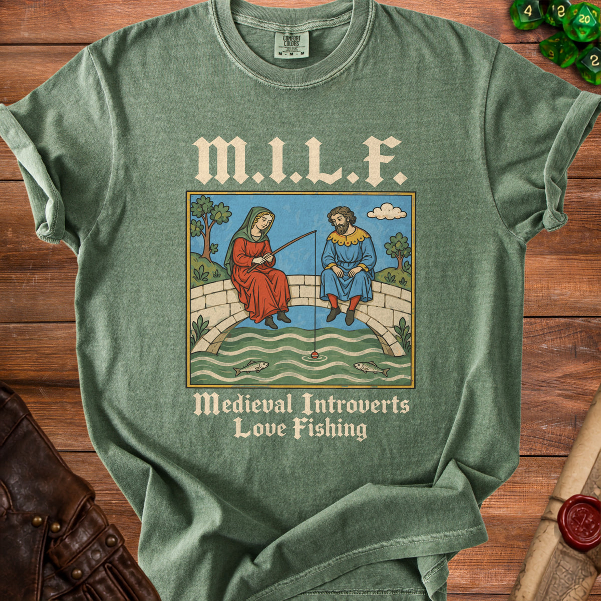 Green t-shirt with medieval illustration of people fishing and text "M.I.L.F. Medieval Introverts Love Fishing".