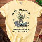 Yellow t-shirt with goblin graphic and text "Reject Modernity Embrace Being a Silly Little Goblin".
