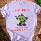 Light purple t-shirt with "I'm an adult the same way a tomato is a fruit" and a goblin graphic.