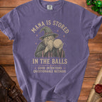 Purple t-shirt with wizard graphic and text "Mana is Stored in the Balls: Good Intentions, Questionable Methods".