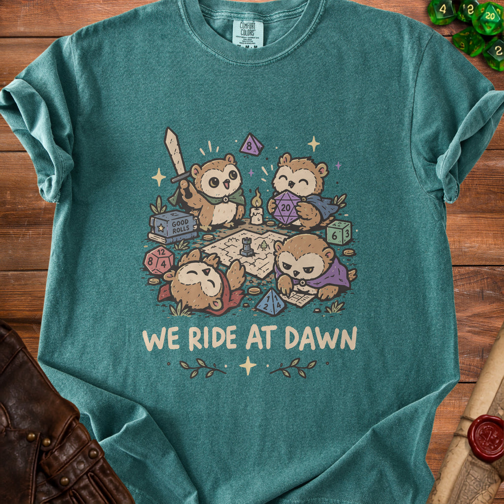 Owl characters playing tabletop RPG with dice, map, and sword, text "WE RIDE AT DAWN".