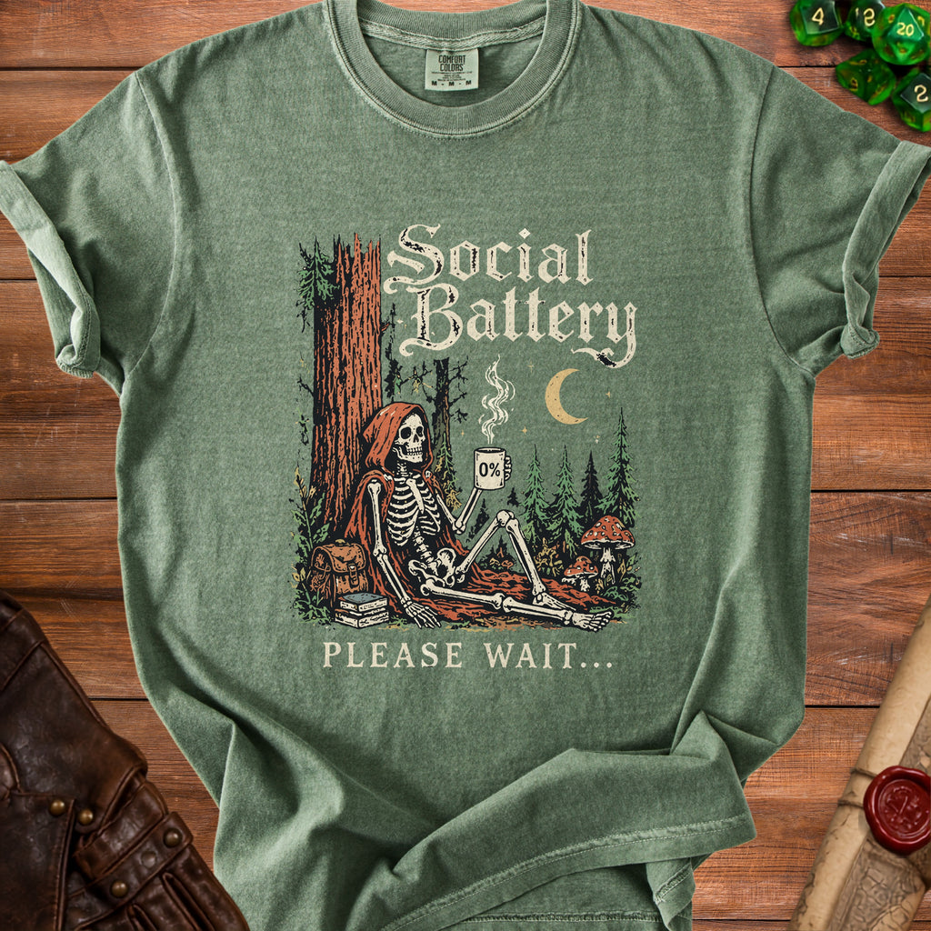Green t-shirt with skeleton and "Social Battery 0% PLEASE WAIT..." graphic.