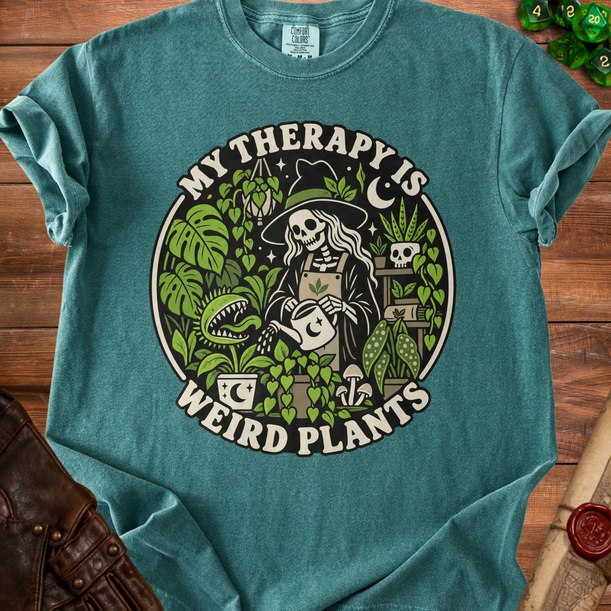 Skeleton gardener in witch hat watering plants with text "My Therapy Is Weird Plants."