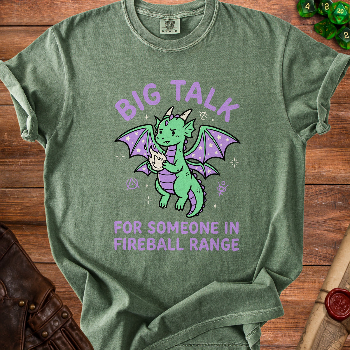 Green t-shirt with "Big Talk For Someone In Fireball Range" and a cartoon dragon.
