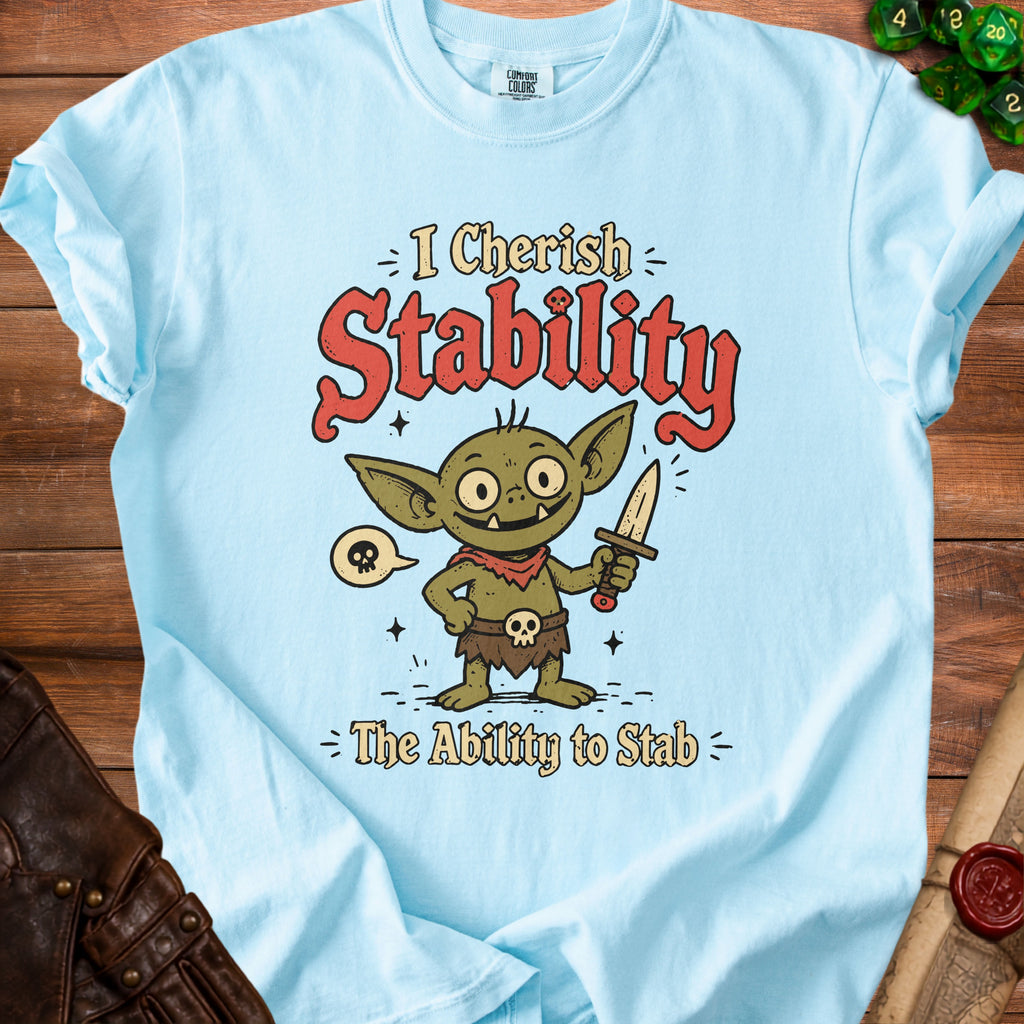 Light blue t-shirt with a goblin holding a knife and the text "I Cherish Stability The Ability to Stab".