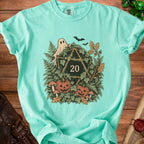 Teal t-shirt with D20, ghost, bats, pumpkins, mushrooms, and foliage design.