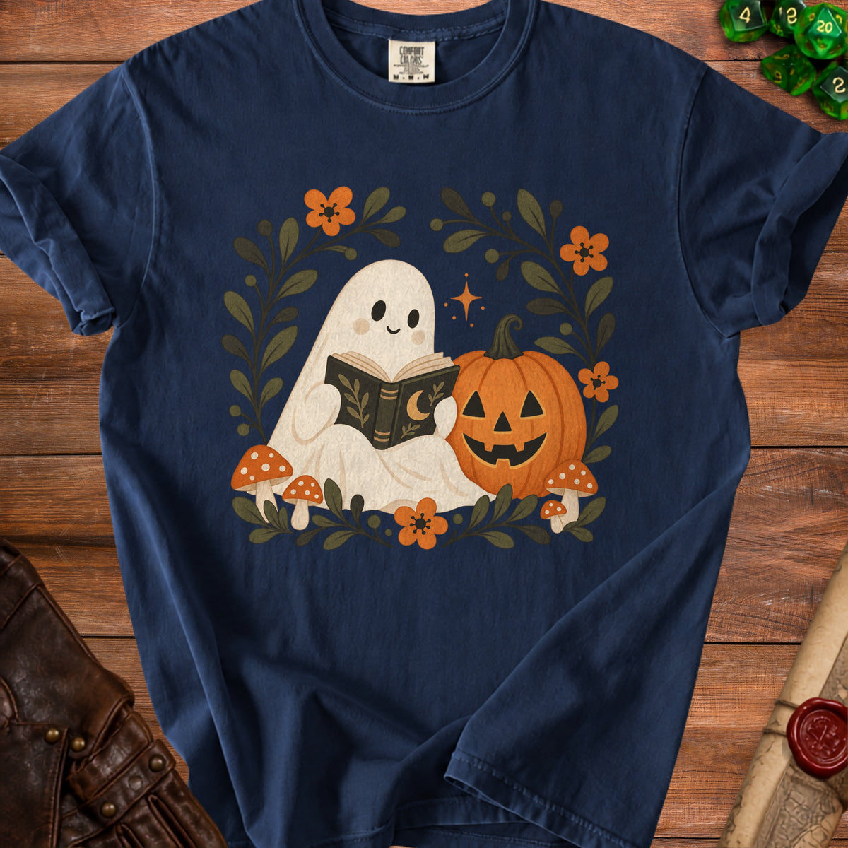 Ghost reading a book next to a pumpkin and mushrooms with floral accents.
