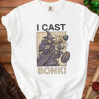 White t-shirt with "I CAST BONK!" text and a wizard attacking a skeleton graphic.