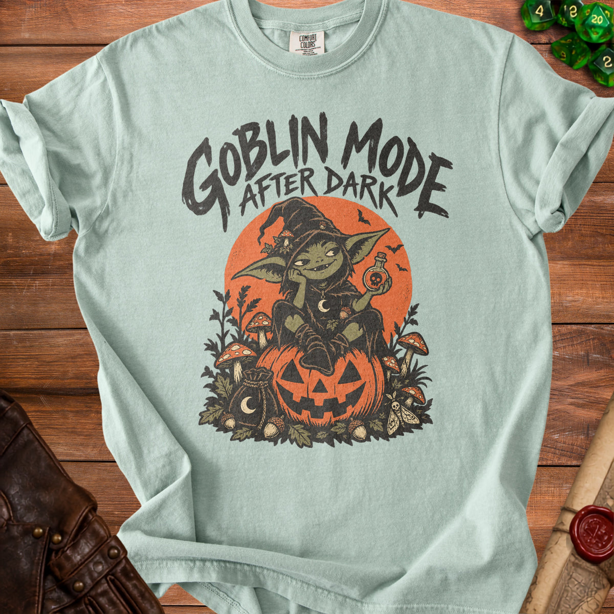Goblin Mode After Dark graphic t-shirt with witch goblin on pumpkin.