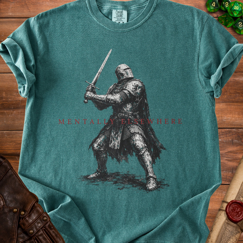 Green t-shirt with knight and "Mentally Elsewhere" text.