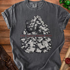Dark t-shirt with knight's helmet buried in scrolls, text reads "THE QUEST NEVER ENDS".
