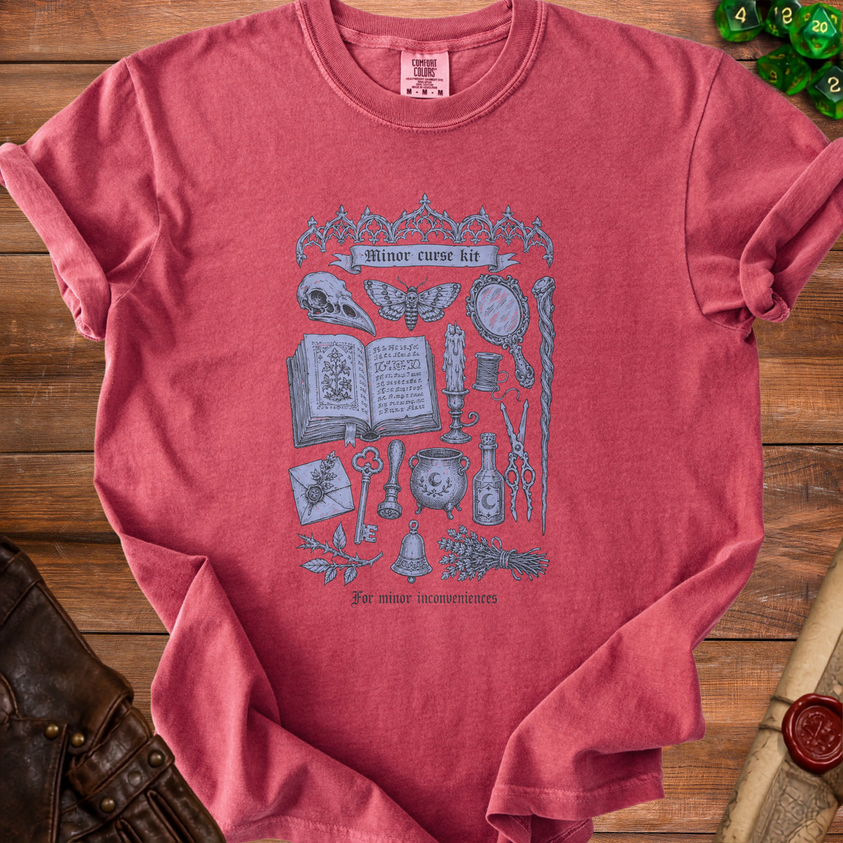 T-shirt with "Minor curse kit" graphic and gothic font text "For minor inconveniences".
