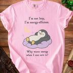 Pink t-shirt with a penguin napping on a cloud and text "I'm not lazy, I'm energy-efficient."
