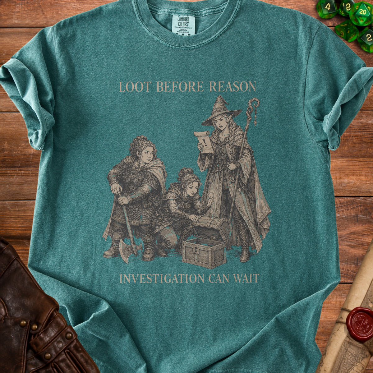 T-shirt graphic with fantasy characters opening a treasure chest and the text "LOOT BEFORE REASON INVESTIGATION CAN WAIT".