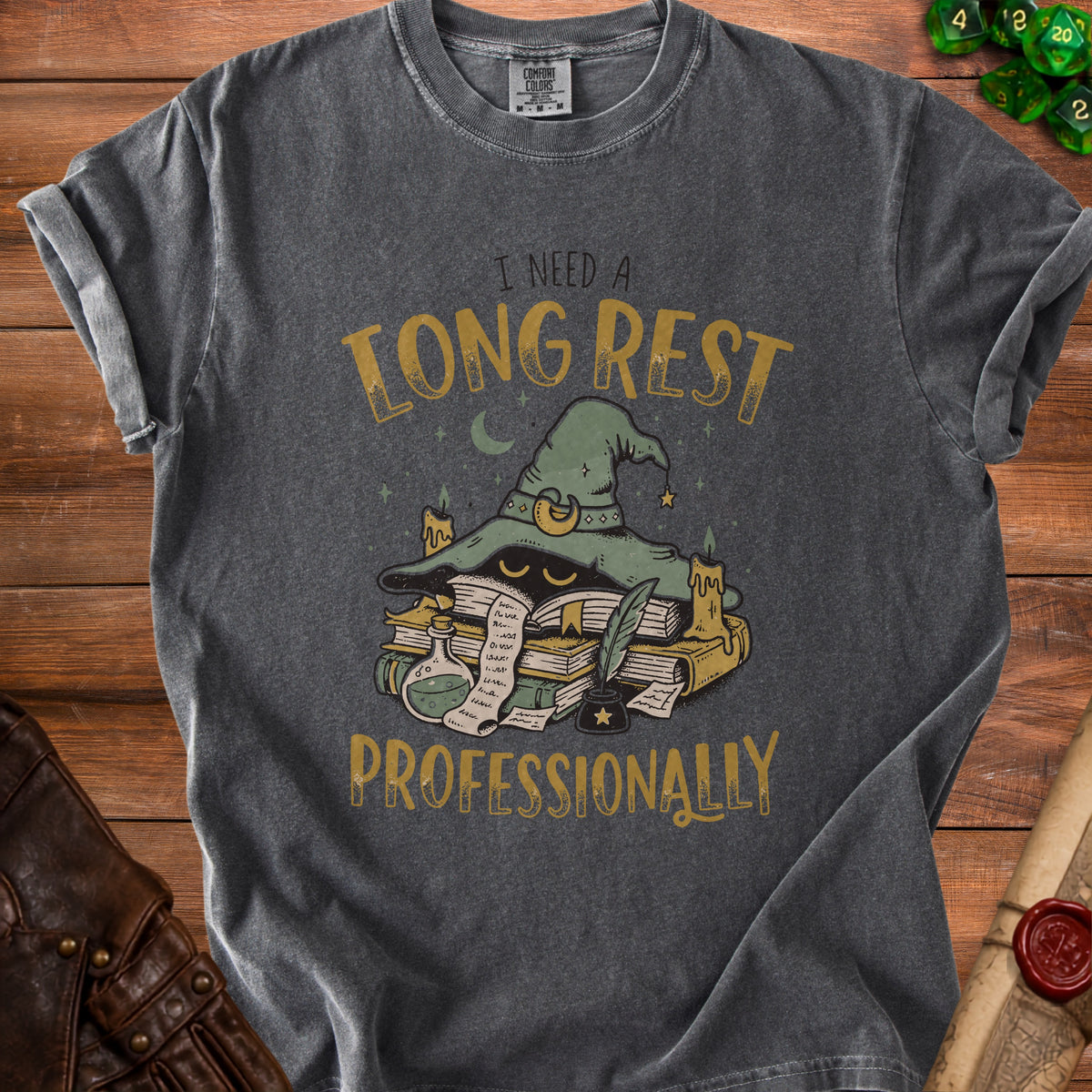 Dark gray t-shirt with witch hat, books, and text "I NEED A LONG REST PROFESSIONALLY".
