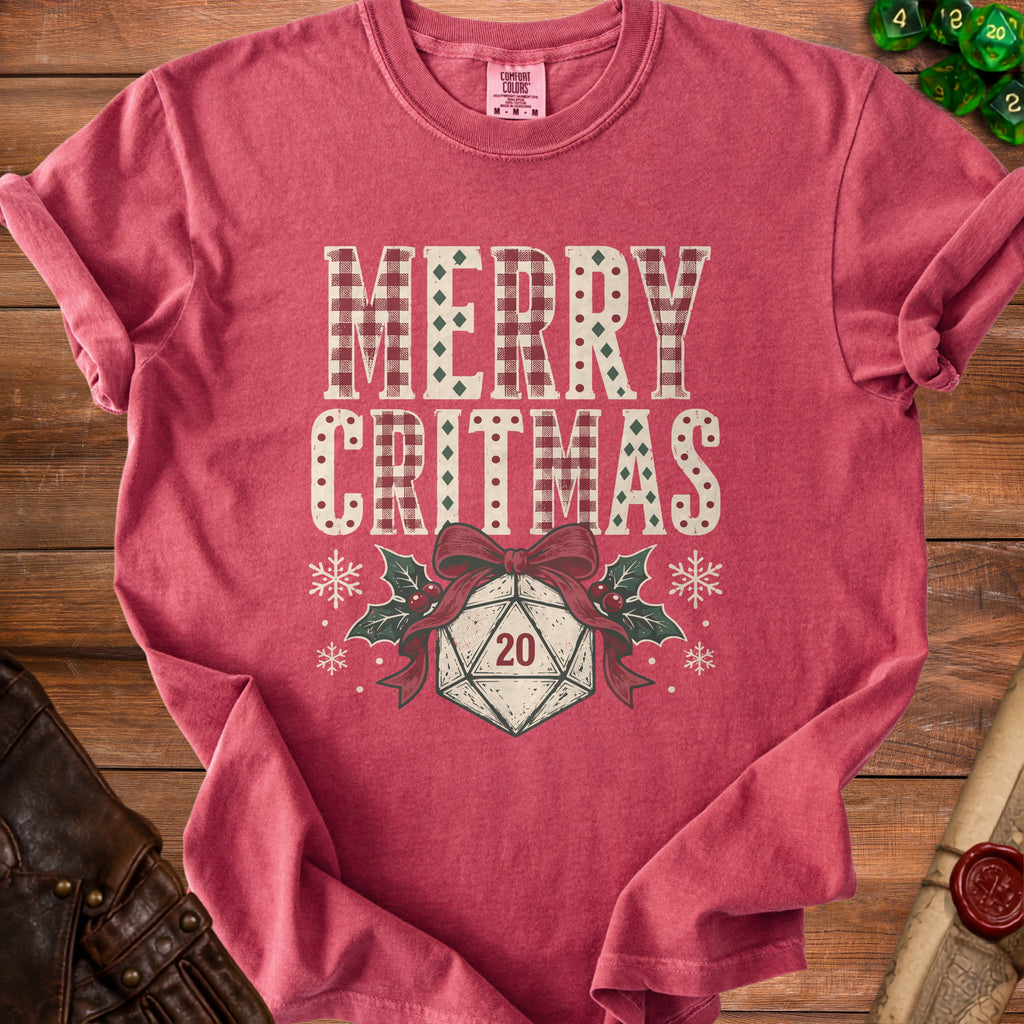 Red t-shirt with "Merry Critmas" text, a d20 die, and holly.