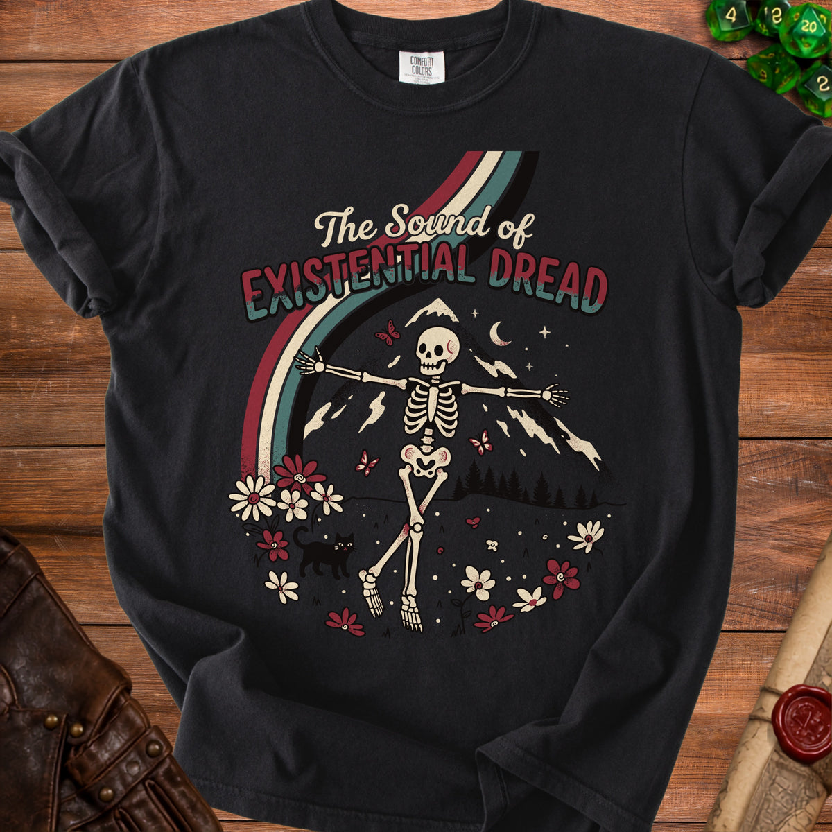 Skeleton dancing in a field with mountains, rainbow, and flowers, text "The Sound of Existential Dread."