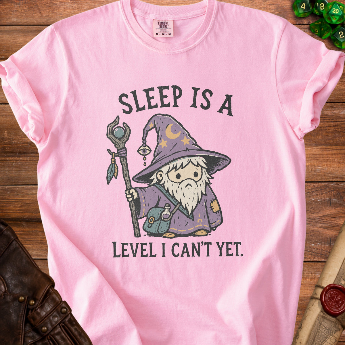 Pink t-shirt with wizard gnome graphic reading "Sleep is a Level I Can't Yet."