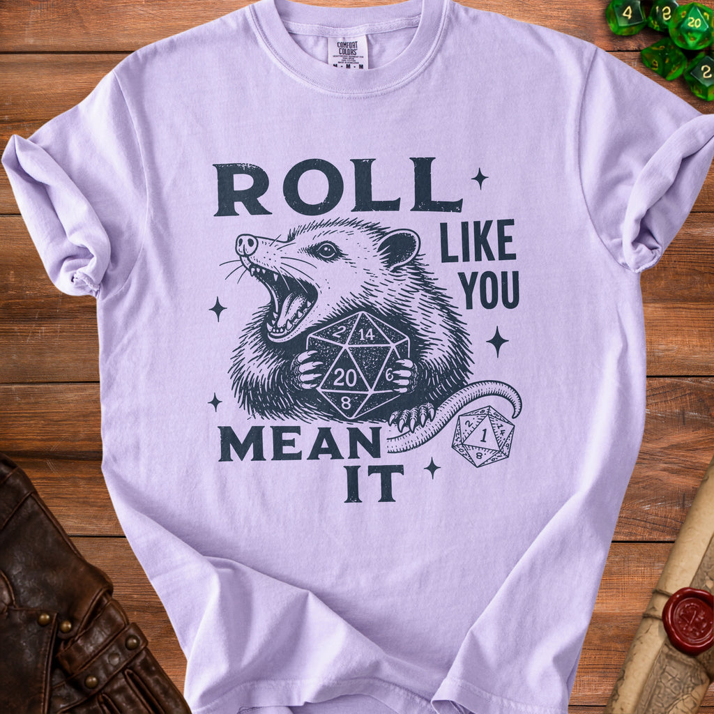 Opossum holding dice with text "ROLL LIKE YOU MEAN IT".
