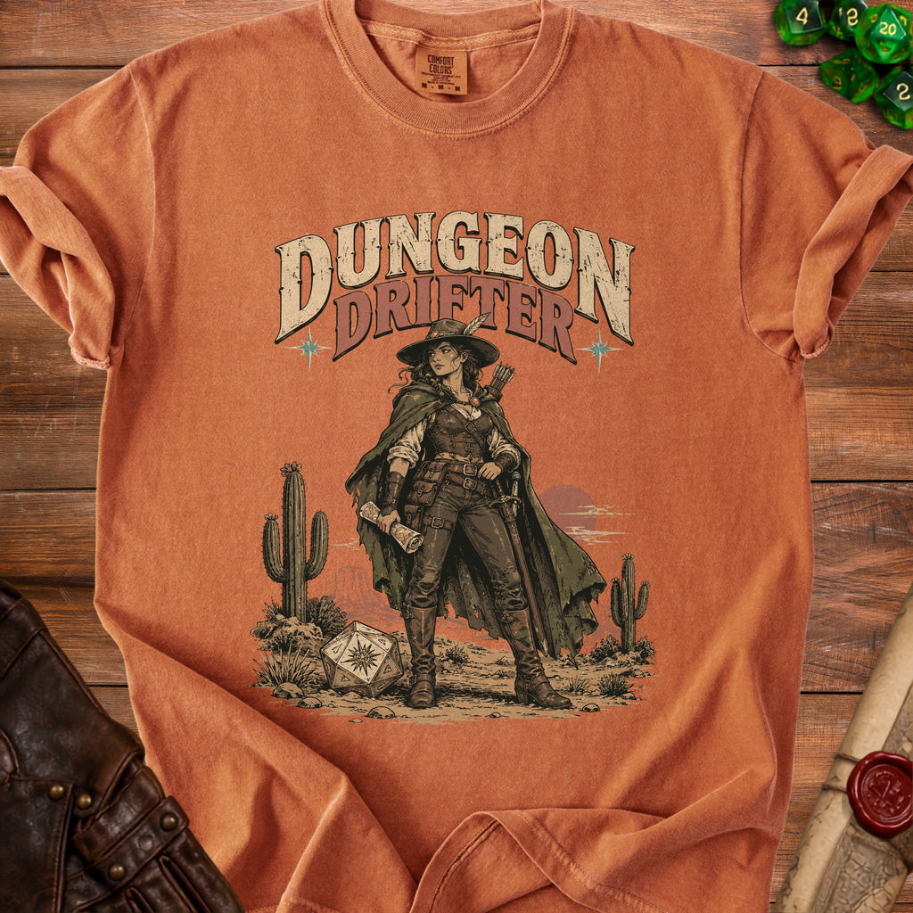 Orange crewneck t-shirt featuring a western graphic of a female adventurer and the text Dungeon Drifter.
