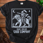 Black t-shirt with white graphic of knight riding a dog, text "BAD IDEAS GOOD COMPANY".