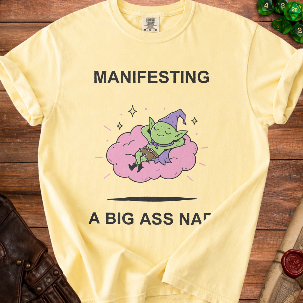 Yellow Comfort Colors t-shirt with text "MANIFESTING A BIG ASS NAP" and goblin graphic.