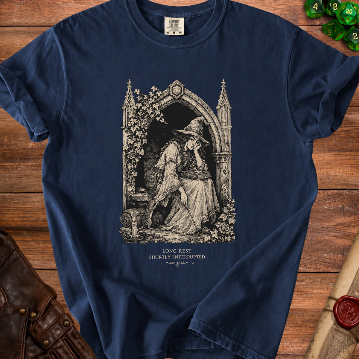 Dark blue t-shirt with graphic of a witch resting, text "LONG REST SHORTLY INTERRUPTED".