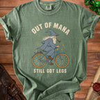 Green t-shirt with wizard on bicycle graphic and text "OUT OF MANA STILL GOT LEGS".