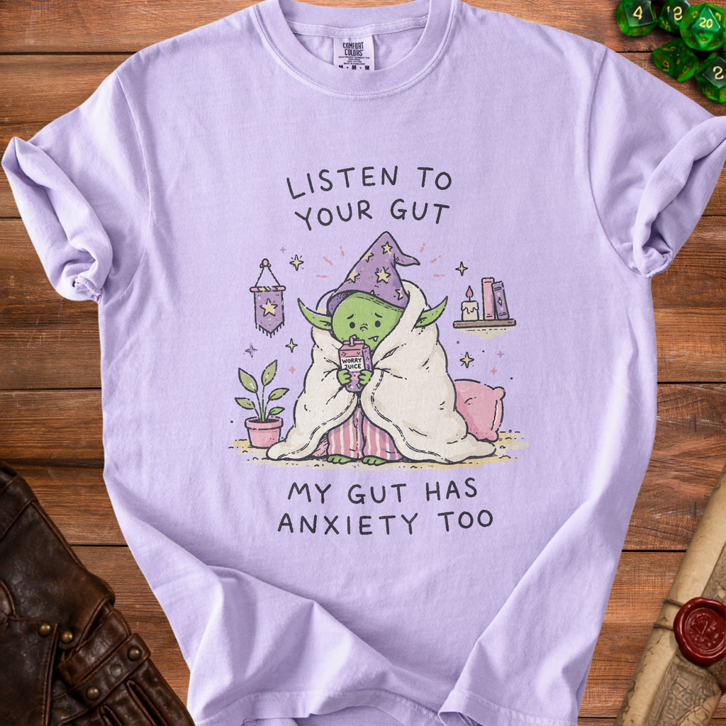 T-shirt with illustration of a green, anxious character in a wizard hat, text says "Listen to Your Gut".