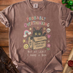 Brown t-shirt with a black cat in a box, text "Probably Overthinking" and "But At Least I Have A Box".