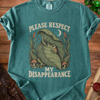 Green t-shirt with "Please Respect My Disappearance" text and a shy frog hiding under a leaf.
