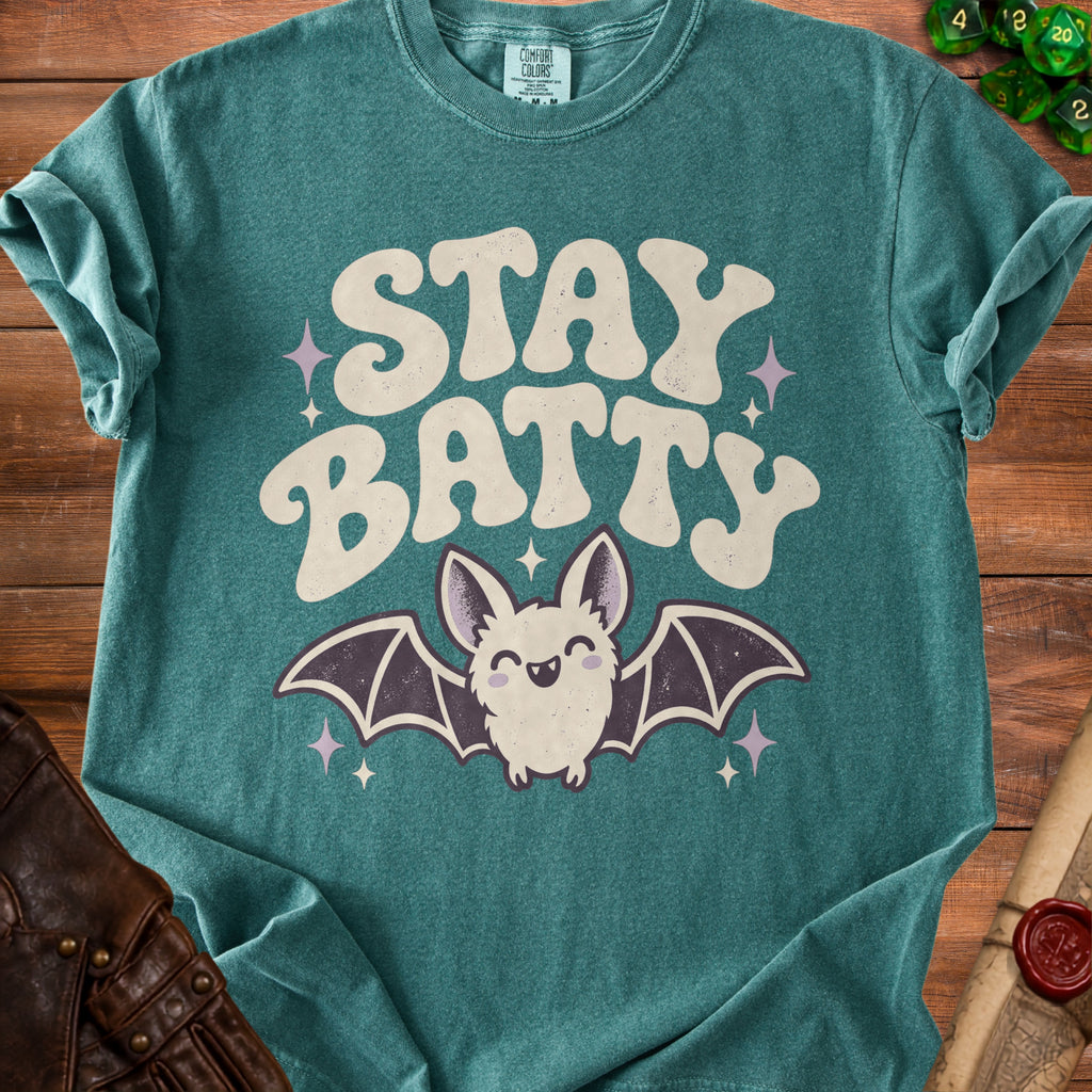 Teal t-shirt with "STAY BATTY" text and a smiling bat graphic.